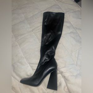 Black knee high heeled leather boots